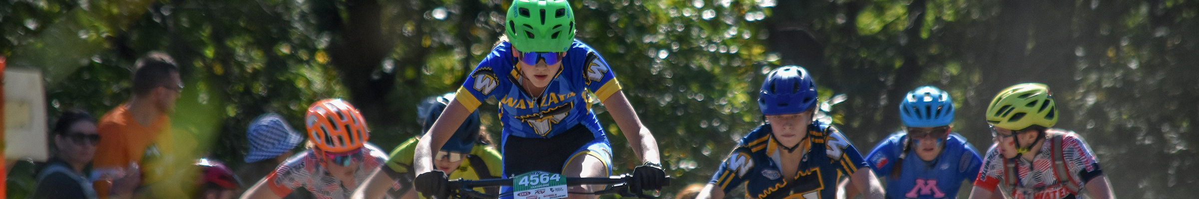 Mountain bikers charging up a hill at Lake Rebecca Regional Park